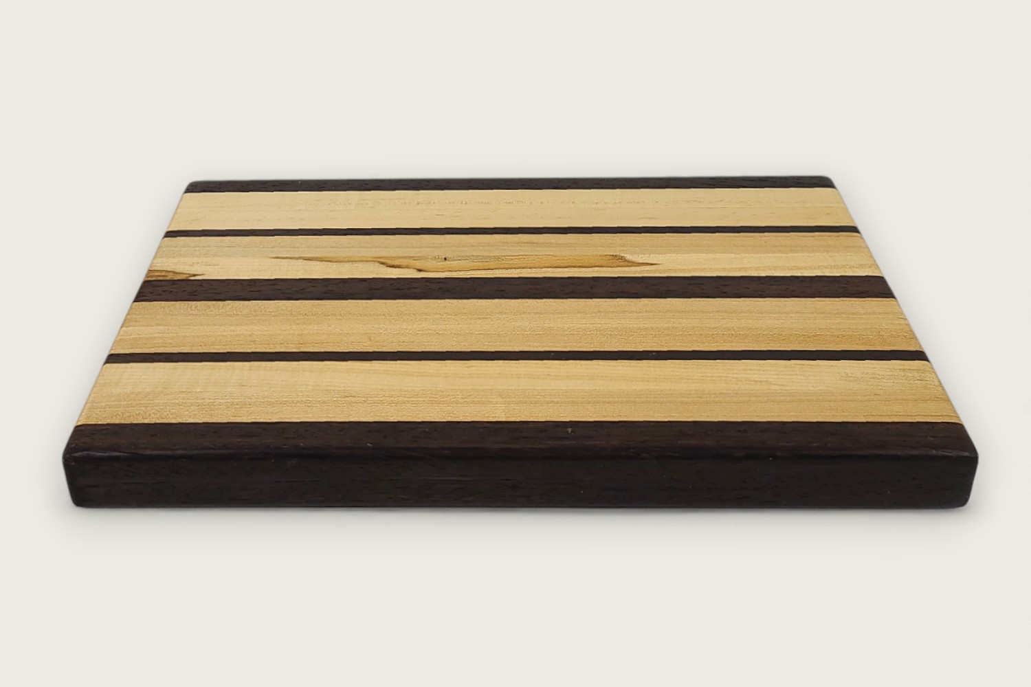 Maple & Wenge Butcher Block (#105) with light maple edge grain, dark wenge accents, and a rectangular shape.